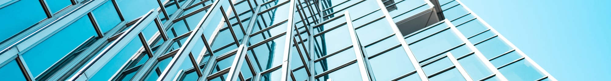 Panoramic and perspective view of blue glass high rise building